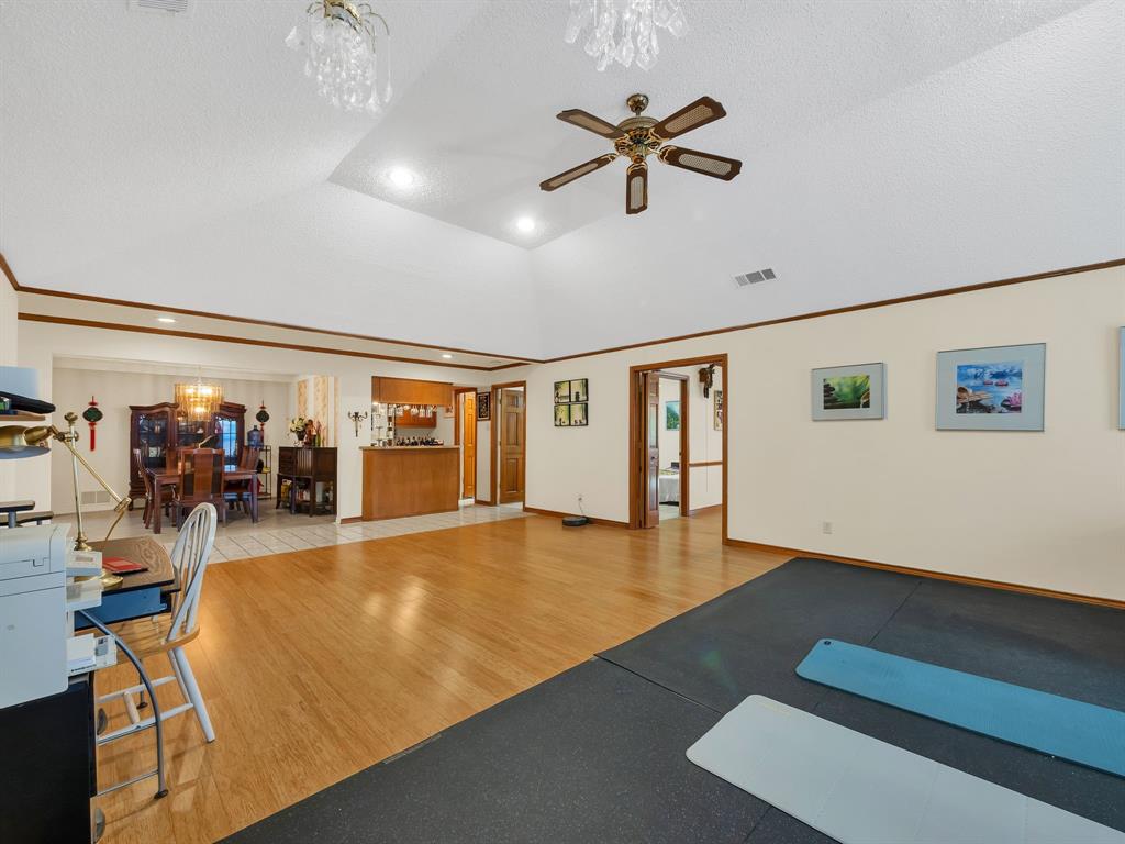 10211 Shadow Way Dallas, TX 75243 - Photo 12 of 39 a view of a room with gym equipment