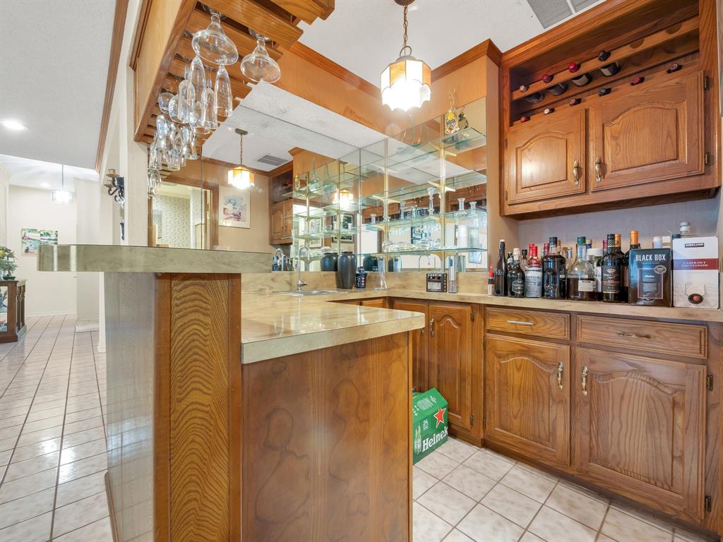 10211 Shadow Way Dallas, TX 75243 - Photo 13 of 39 a kitchen with stainless steel appliances granite countertop a sink and cabinets