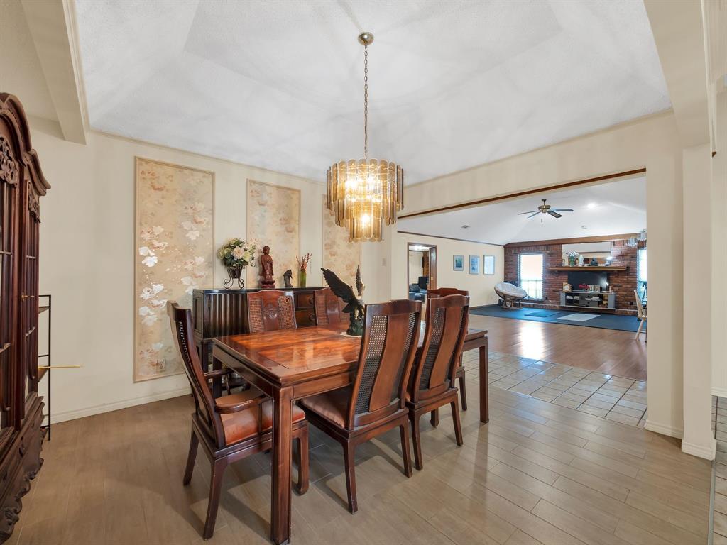 10211 Shadow Way Dallas, TX 75243 - Photo 16 of 39 a view of a dining room with furniture window and wooden floor