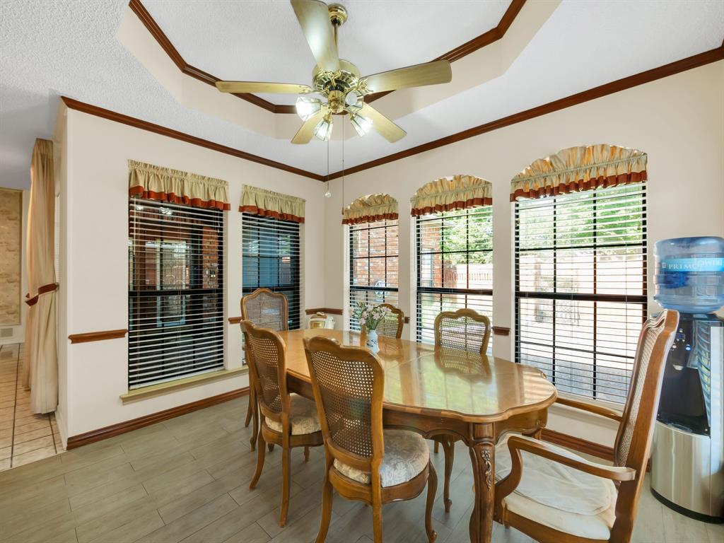 10211 Shadow Way Dallas, TX 75243 - Photo 26 of 39 a view of a dining room with furniture wooden floor and chandelier