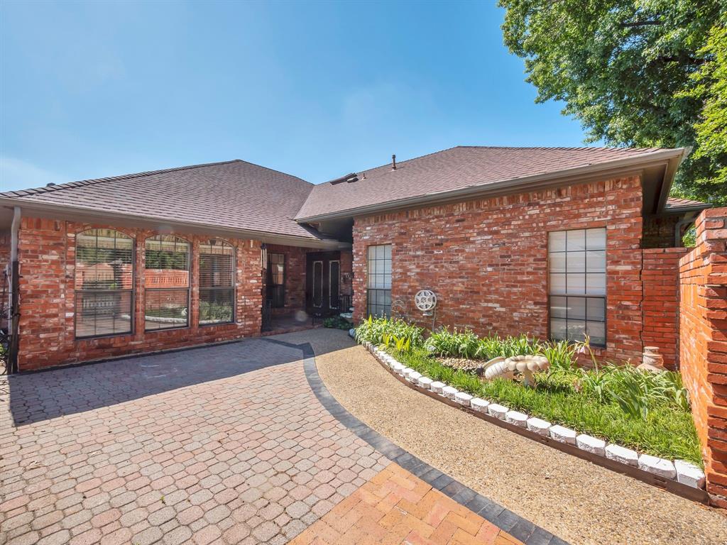 10211 Shadow Way Dallas, TX 75243 - Photo 4 of 39 a view of a house with a garden
