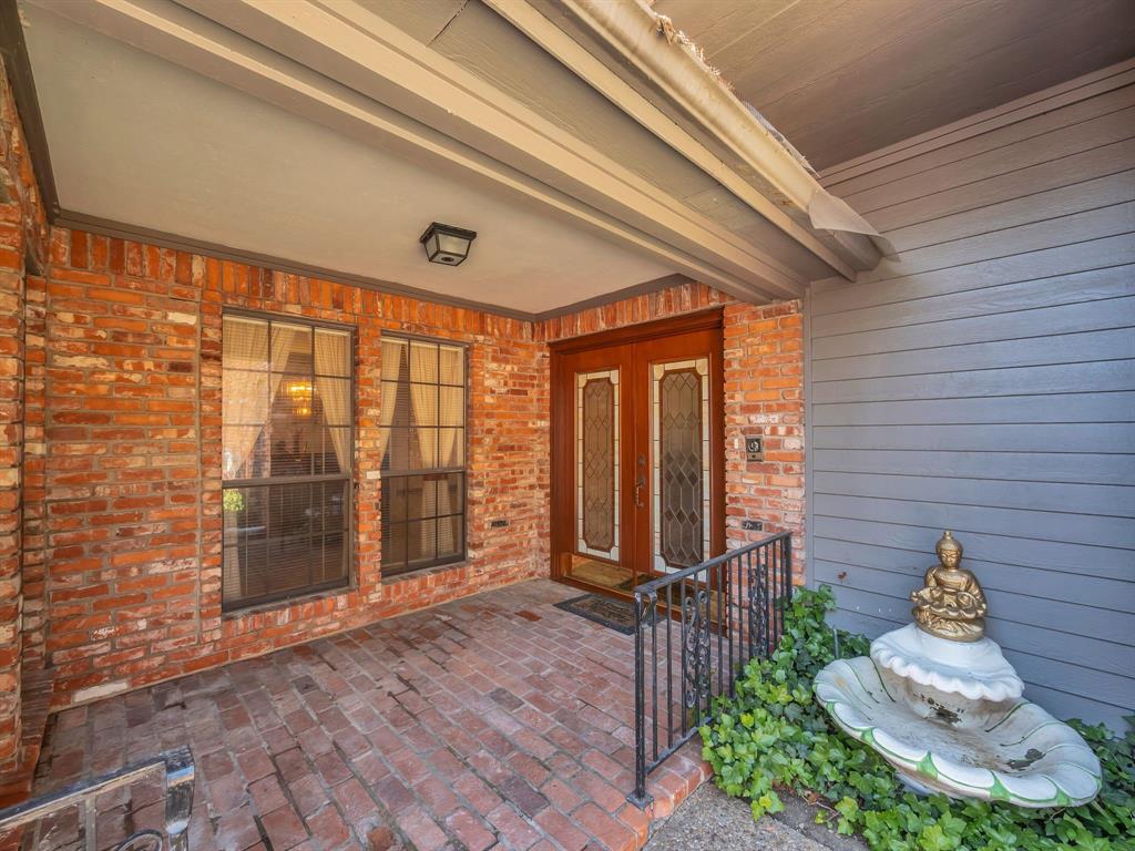 10211 Shadow Way Dallas, TX 75243 - Photo 6 of 39 a front view of a house with a yard