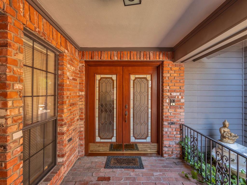 10211 Shadow Way Dallas, TX 75243 - Photo 7 of 39 a front view of a building with glass door