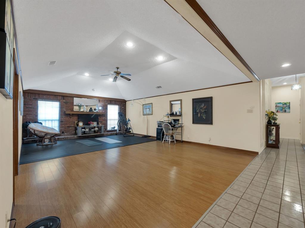 10211 Shadow Way Dallas, TX 75243 - Photo 10 of 39 a view of a livingroom with furniture and a flat screen tv