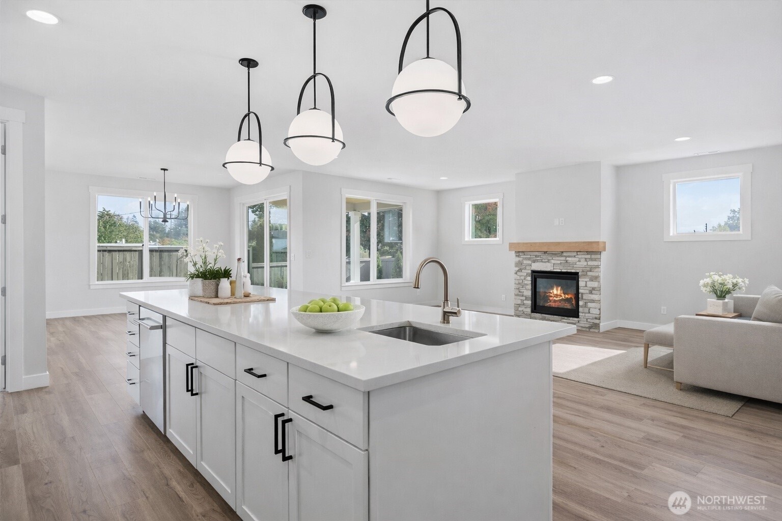 632 Prominence Street Winlock, WA 98596 - Photo 2 of 9 a kitchen with sink cabinets and chandelier