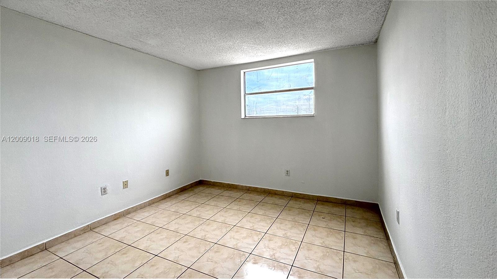 666 West 81st Street, Unit 304 Hialeah, FL 33014 - Photo 11 of 21 an empty room with white walls