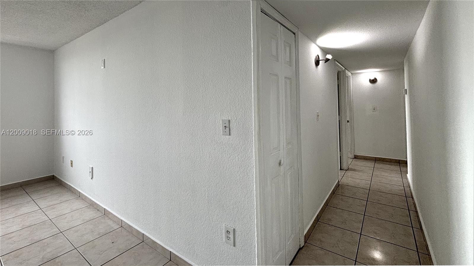666 West 81st Street, Unit 304 Hialeah, FL 33014 - Photo 7 of 21 a view of hallway with shower