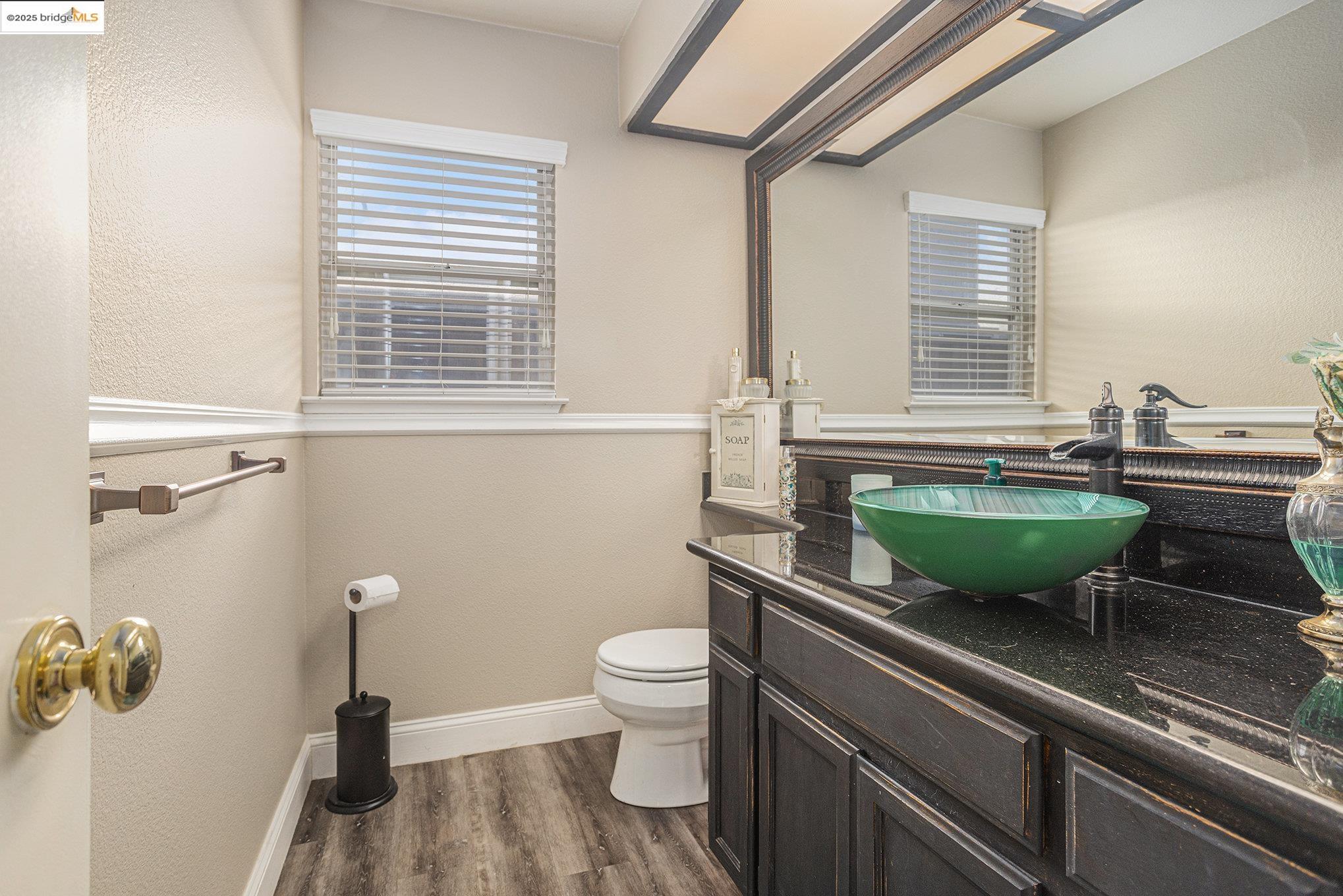 2059 Heartland Court Brentwood, CA 94513 - Photo 18 of 37 a view of a bathroom with a sink and a toilet