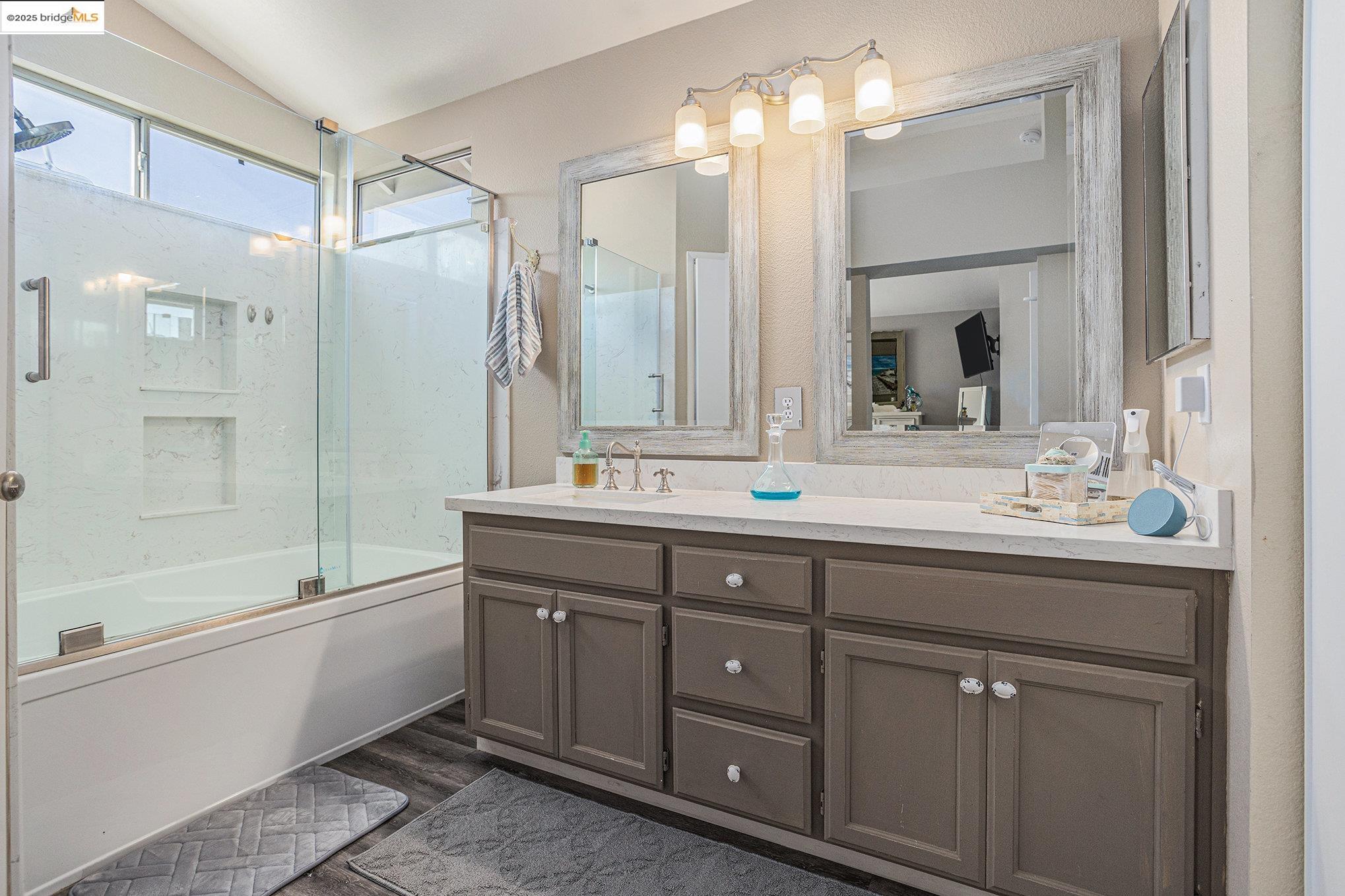 2059 Heartland Court Brentwood, CA 94513 - Photo 21 of 37 a bathroom with a double vanity sink mirror and shower