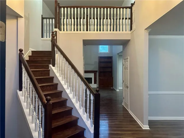 a view of a staircase with wooden floor and stairs