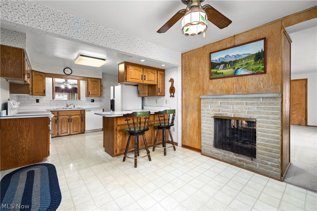 36141 Aurensen Road North Ridgeville, OH 44039 - Photo 4 of 24 large kitchen, with large eating area. Breakfast bar & fireplace!