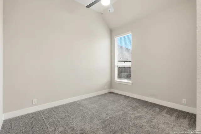 an empty room with a bathroom