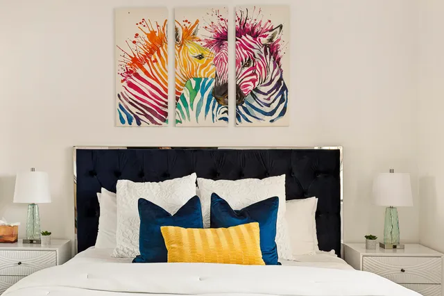 a bedroom with a bed and a night stand