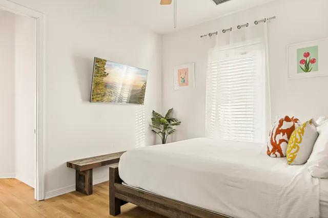 a bedroom with a bed and a couch