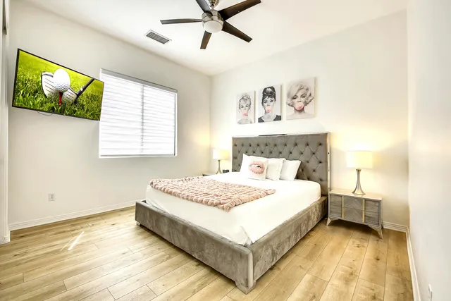 a bedroom with a large bed and a window