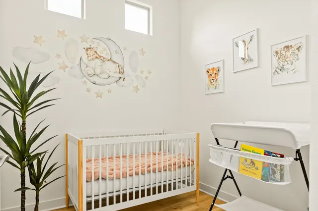 a dining room with furniture a large window and a table