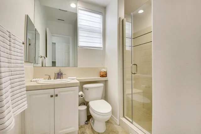 a view of a livingroom with furniture and a floor to ceiling window
