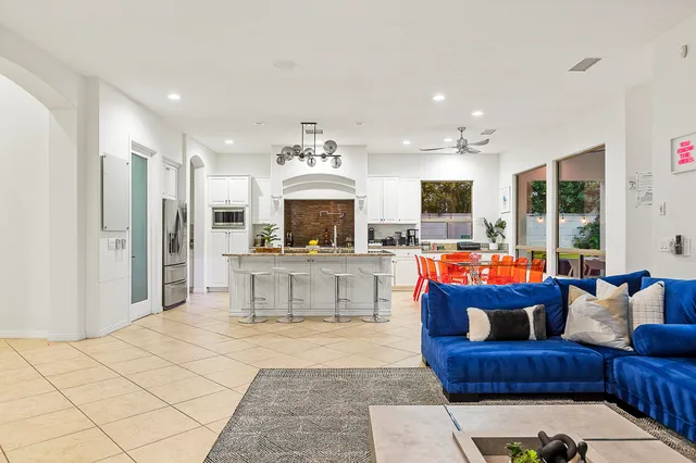 a view of a dining room with furniture and a large window