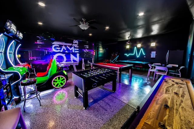 a living room with dining table and chairs