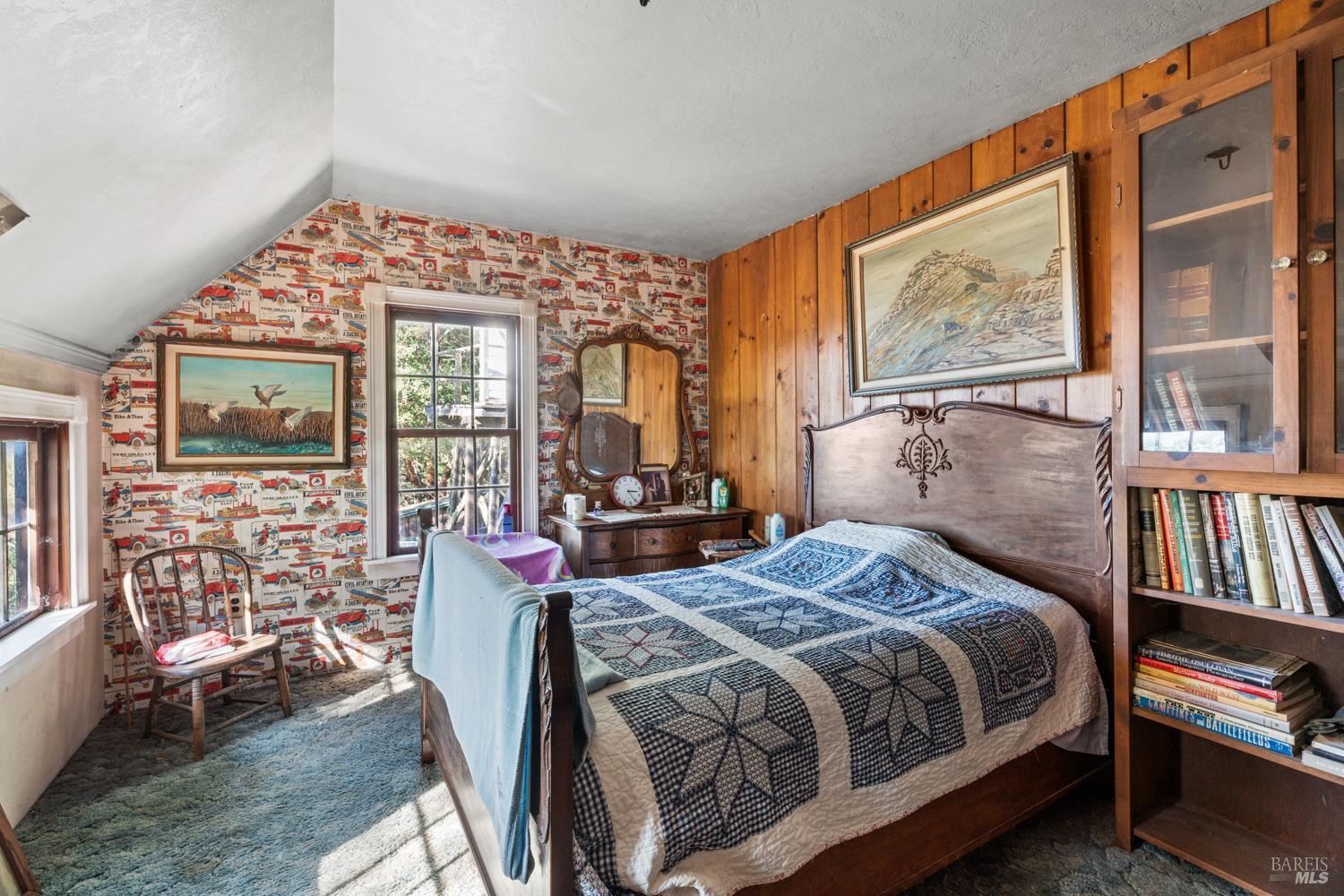 24600 String Creek Road Willits, CA 95490 - Photo 13 of 24 a bedroom with a bed wooden floor and painting on the wall