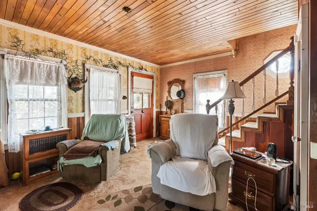 a living room with furniture and a window