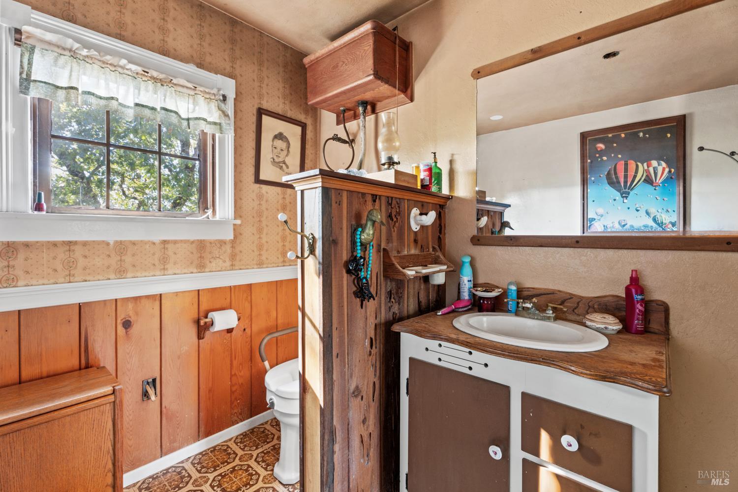 24600 String Creek Road Willits, CA 95490 - Photo 18 of 24 a bathroom with a sink and a mirror