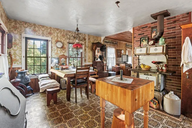 a very nice looking dining room with furniture