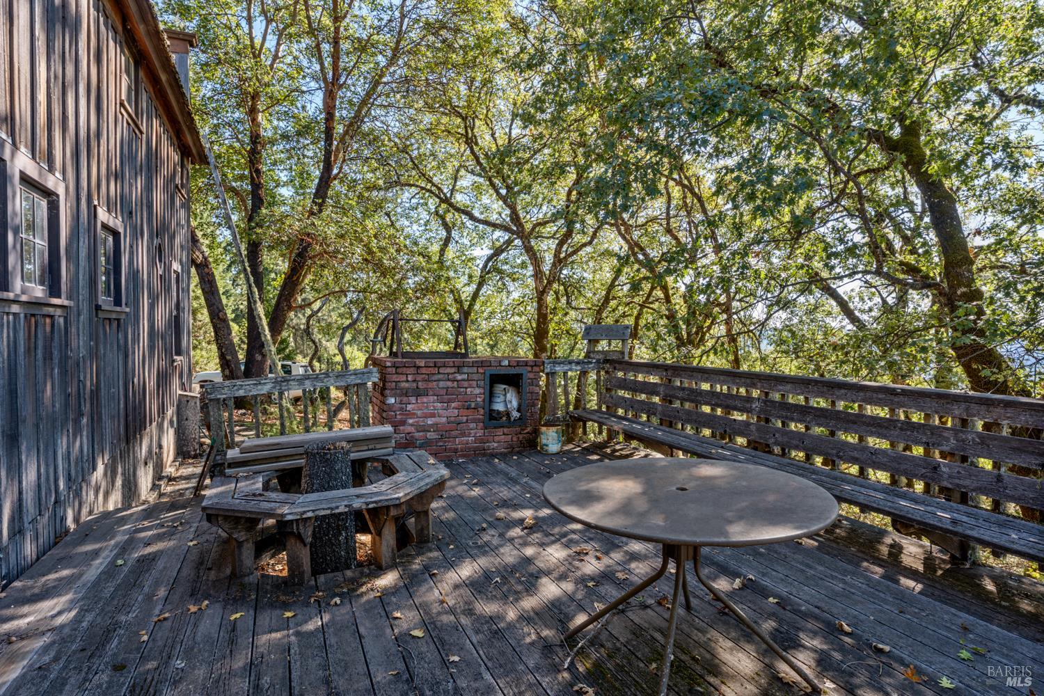 24600 String Creek Road Willits, CA 95490 - Photo 10 of 24 a backyard of a house with table and chairs