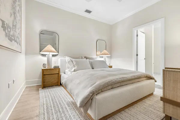 a bedroom with bed and a table