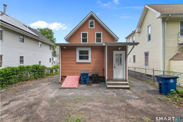 a view of a room with wooden floor and windows