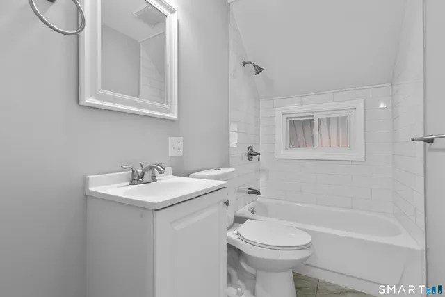 a view of an entryway with wooden floor and windows