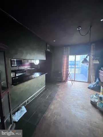 a view of an empty room with a fireplace