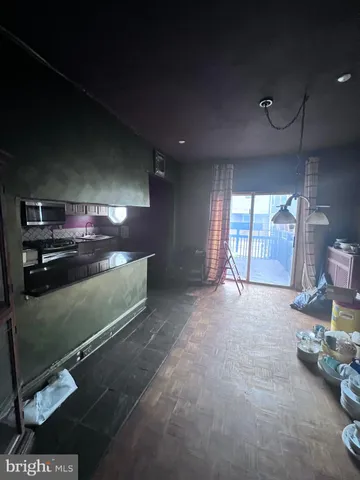 a view of an empty room with a fireplace