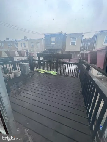 a view of a balcony with furniture