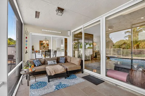 a living room with lots of furniture and a chandelier