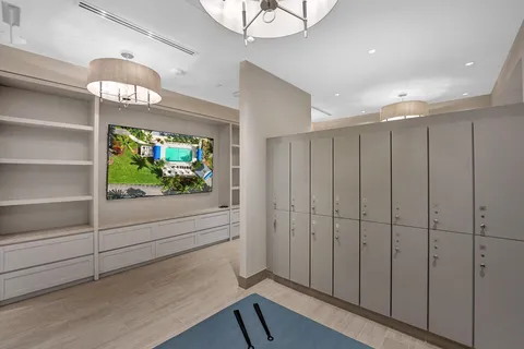 a room with lots of furniture and a large window