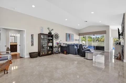 a room with furniture and flat screen tv