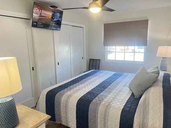 a bedroom with a bed and a couch
