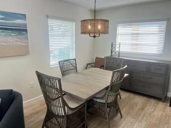 a dining room with furniture and window