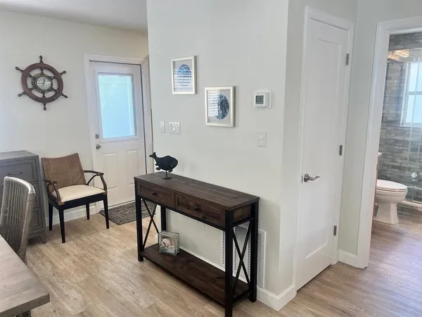 a view of a livingroom with furniture and wooden floor