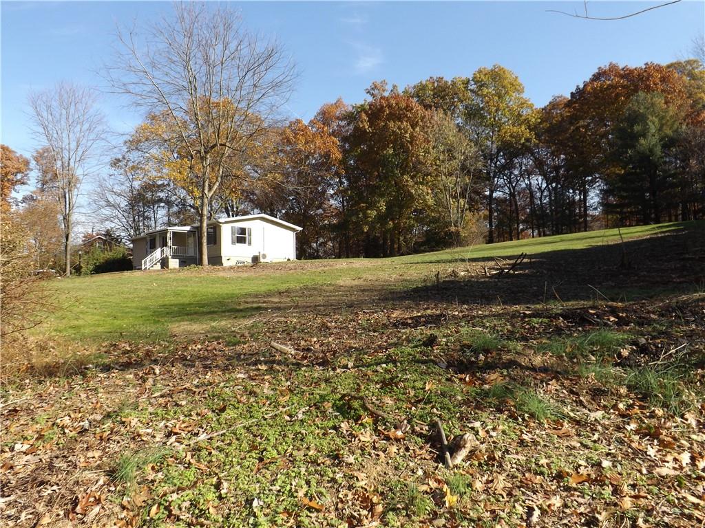 222 Harbison Road Sarver, PA 16055 - Photo 2 of 21 a view of a field with large trees