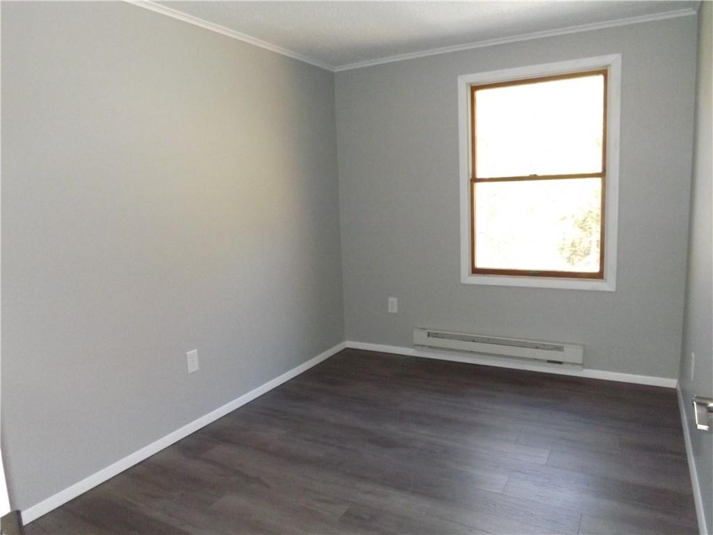 222 Harbison Road Sarver, PA 16055 - Photo 11 of 21 an empty room with wooden floor and a window