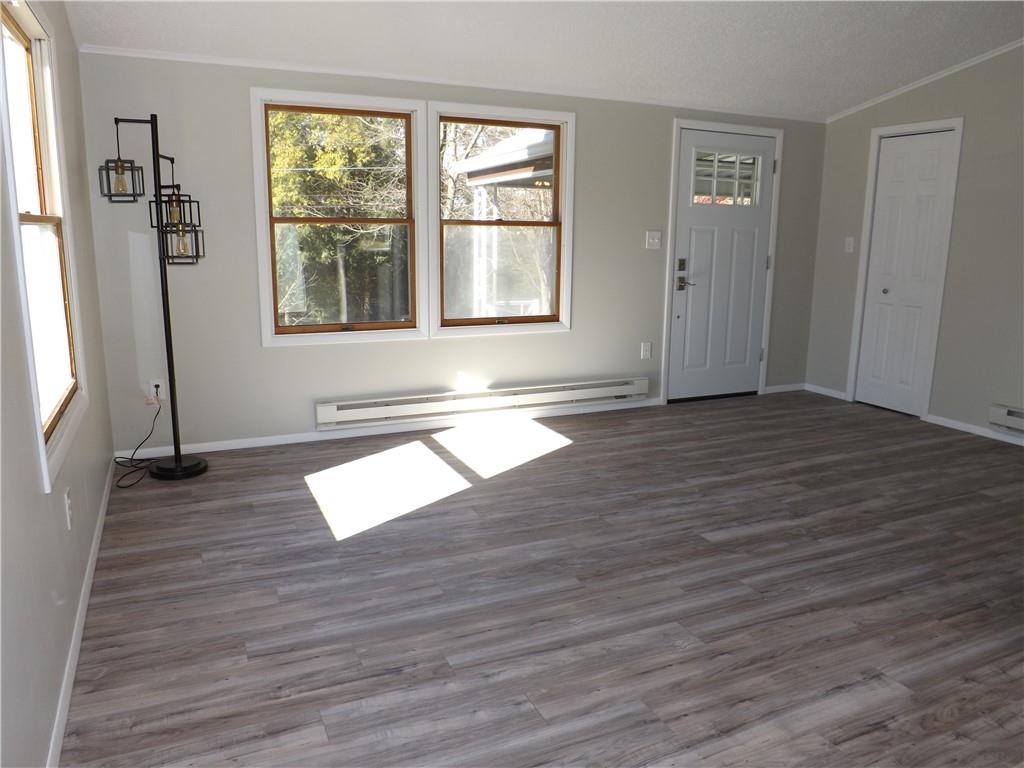 222 Harbison Road Sarver, PA 16055 - Photo 3 of 21 an empty room with wooden floor and windows
