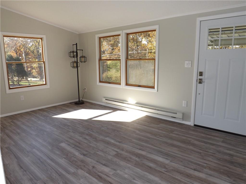 222 Harbison Road Sarver, PA 16055 - Photo 4 of 21 an empty room with wooden floor and windows