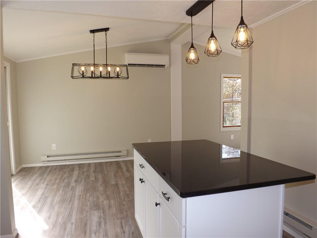 222 Harbison Road Sarver, PA 16055 - Photo 5 of 21 a view of a hallway with wooden floor and chandelier