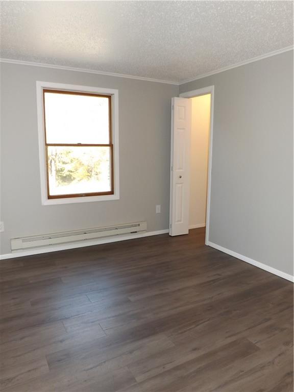 222 Harbison Road Sarver, PA 16055 - Photo 10 of 21 an empty room with wooden floor and a window