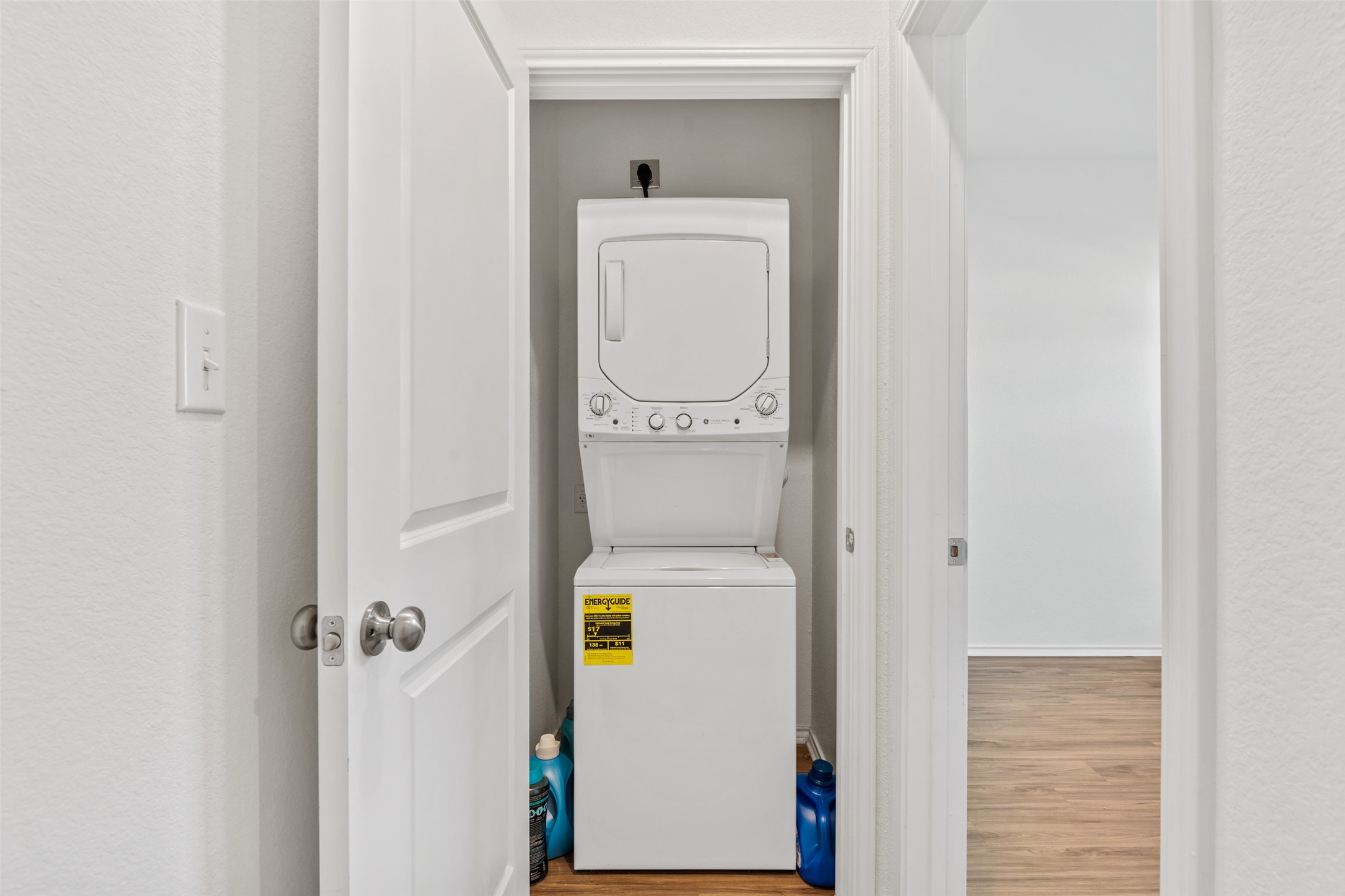 13803 Tordillo Drive Elgin, TX 78621 - Photo 16 of 39 Washroom with wood finished floors and stacked washer / dryer