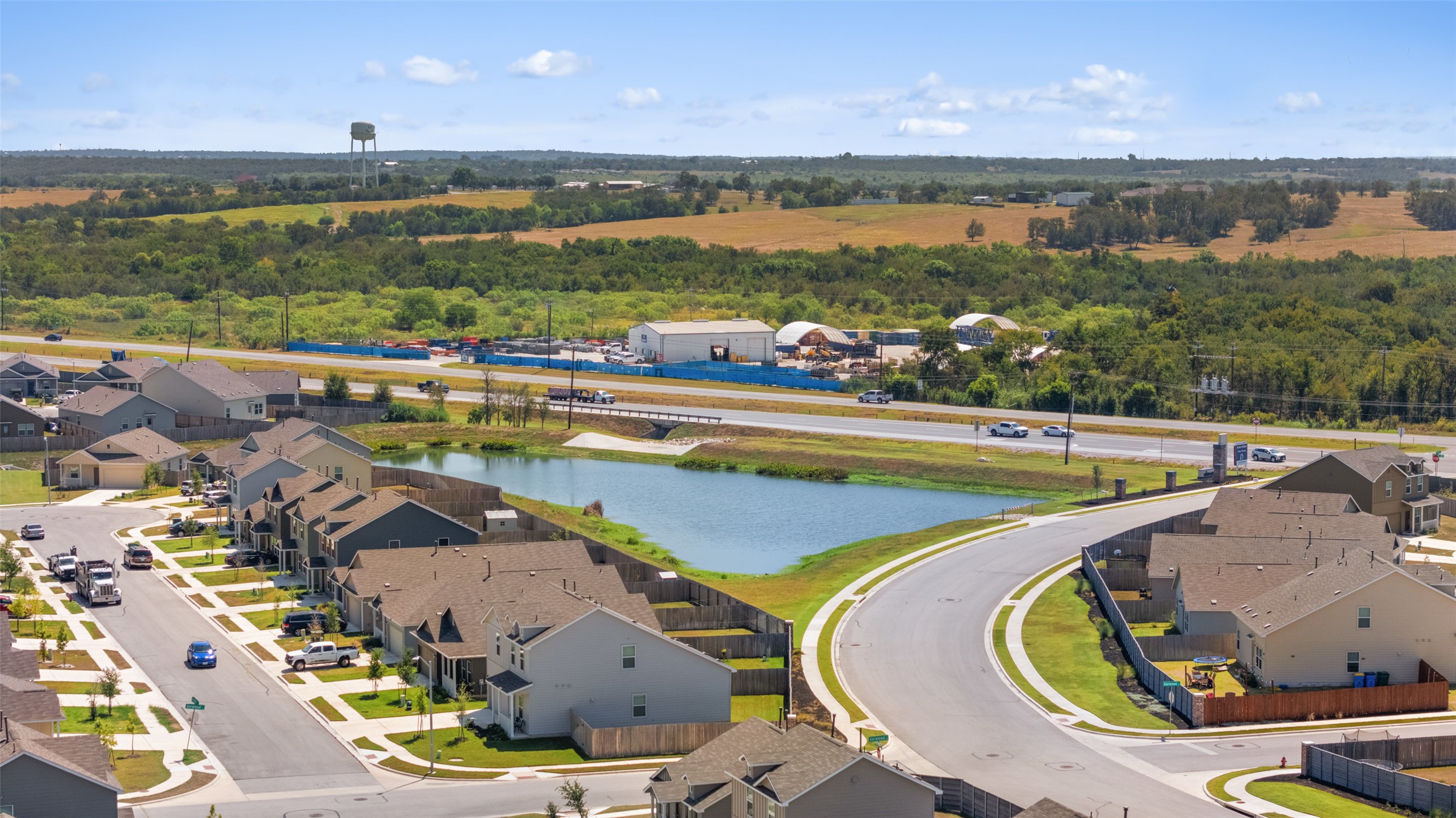 13803 Tordillo Drive Elgin, TX 78621 - Photo 33 of 39 Aerial view of residential area featuring a large body of water