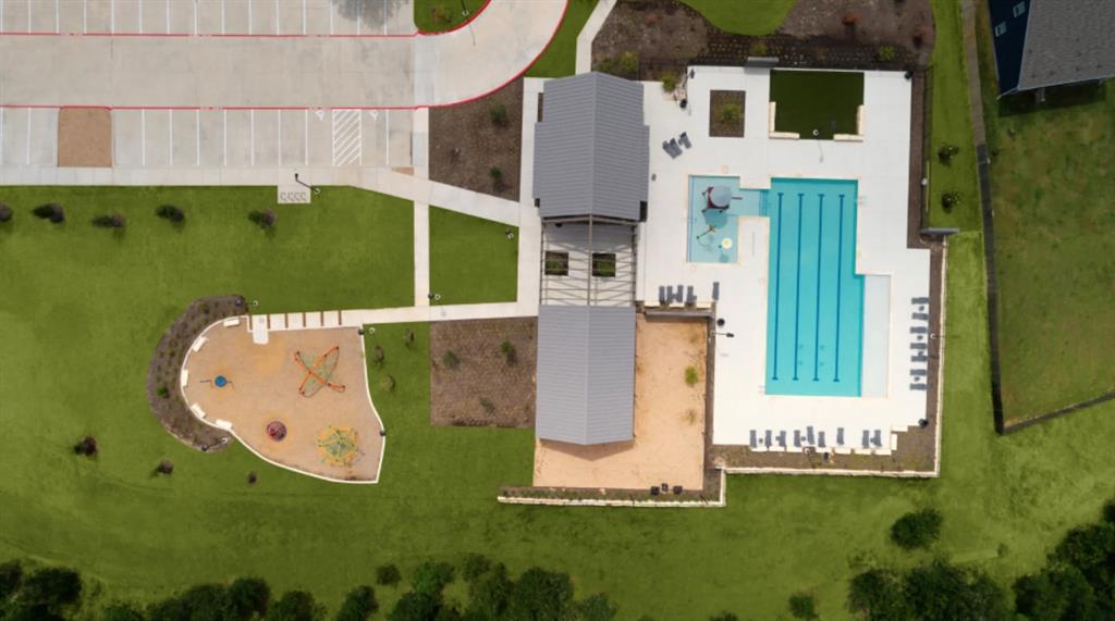 13803 Tordillo Drive Elgin, TX 78621 - Photo 37 of 39 Aerial view of a pool