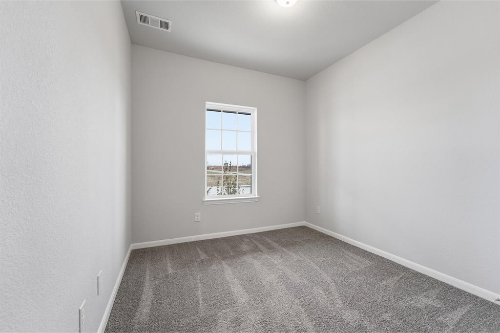 343 Caviar Road Waxahachie, TX 75165 - Photo 15 of 22 an empty room with a window